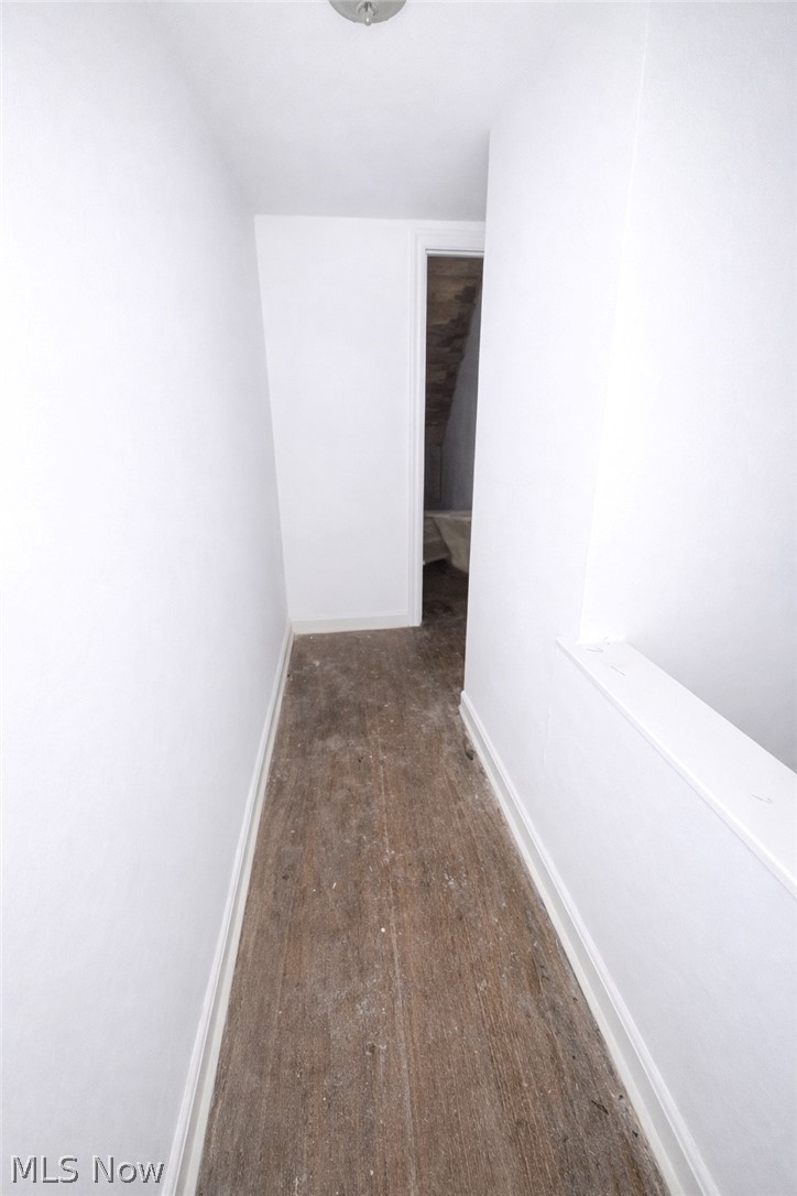 3575 Gridley Road Shaker Heights, OH 44122 - Photo 35 of 47 3rd Floor Hallway featuring baseboards and dark wood finished floors