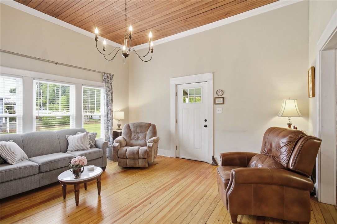 314 South Fairplay Street Seneca, SC 29678 - Photo 9 of 50 This inviting living area boasts gleaming wood floors and ample natural light, perfect for everyday living.