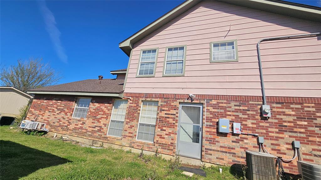 8736 Johns Road Alvarado, TX 76009 - Photo 25 of 32 a front view of a house with a garden