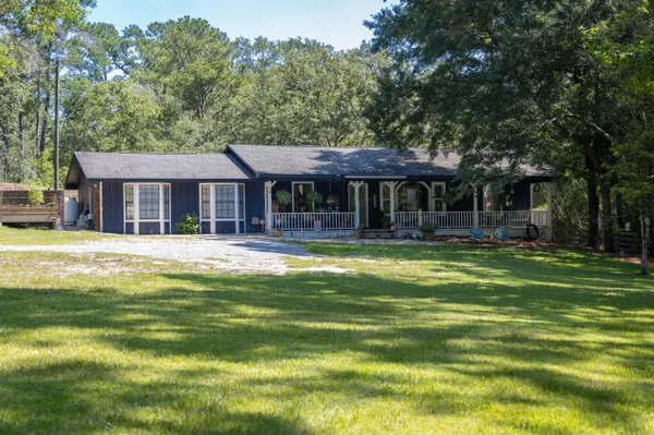 a front view of a house with a swimming pool
