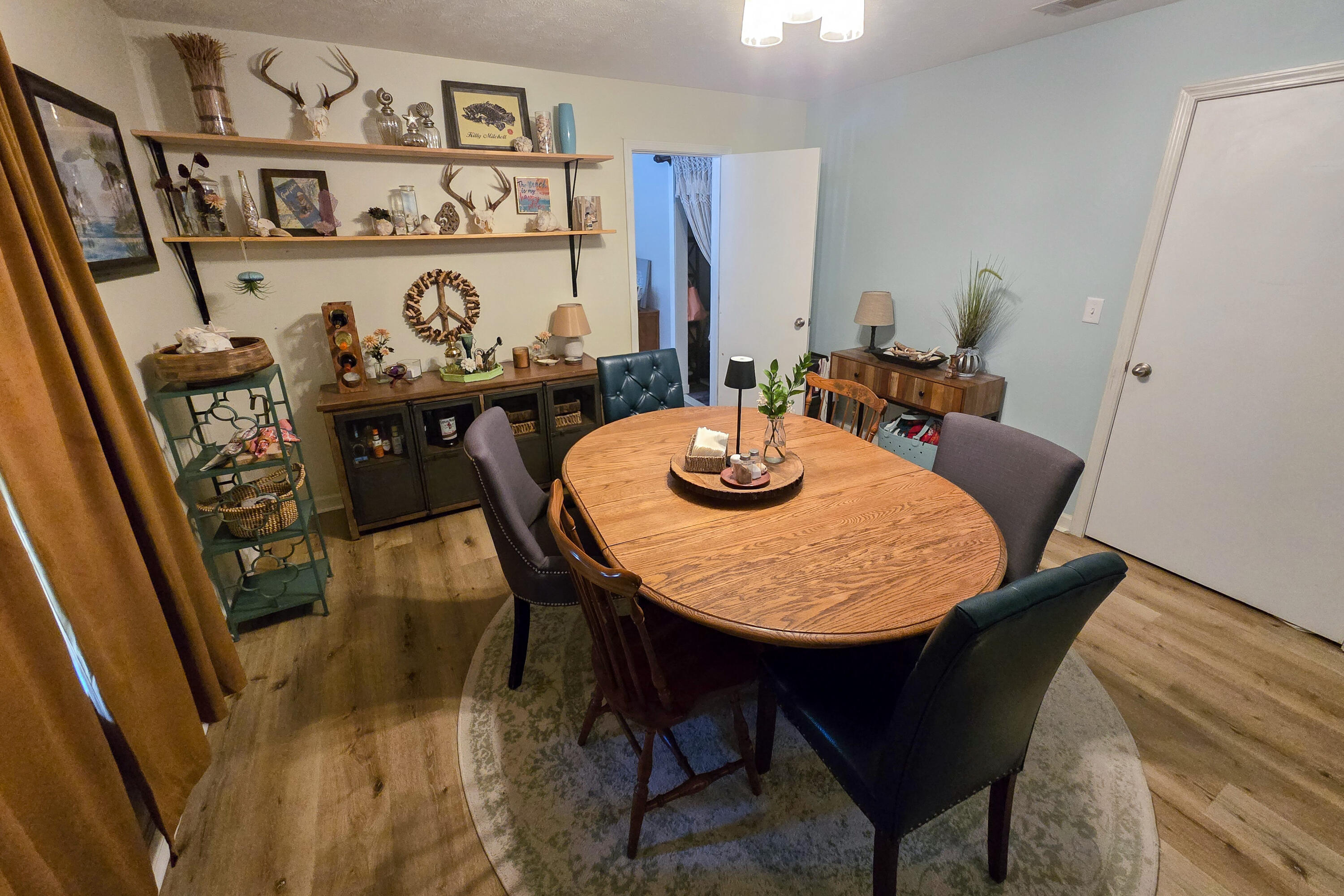 696 Phillips Drive Freeport, FL 32439 - Photo 13 of 49 a view of a dining room with furniture and window