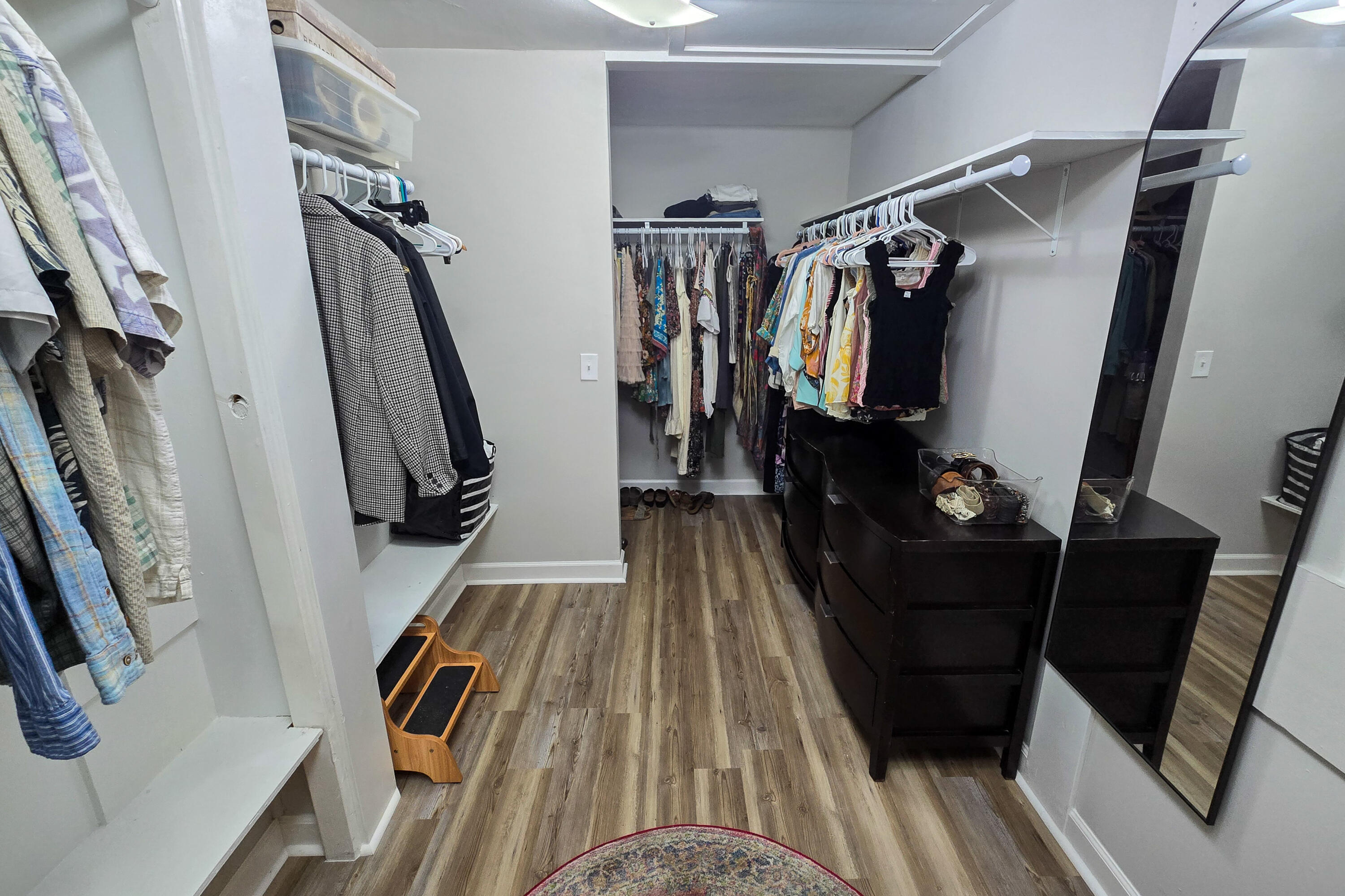 696 Phillips Drive Freeport, FL 32439 - Photo 16 of 49 a view of walk in closet with clothes and shoes