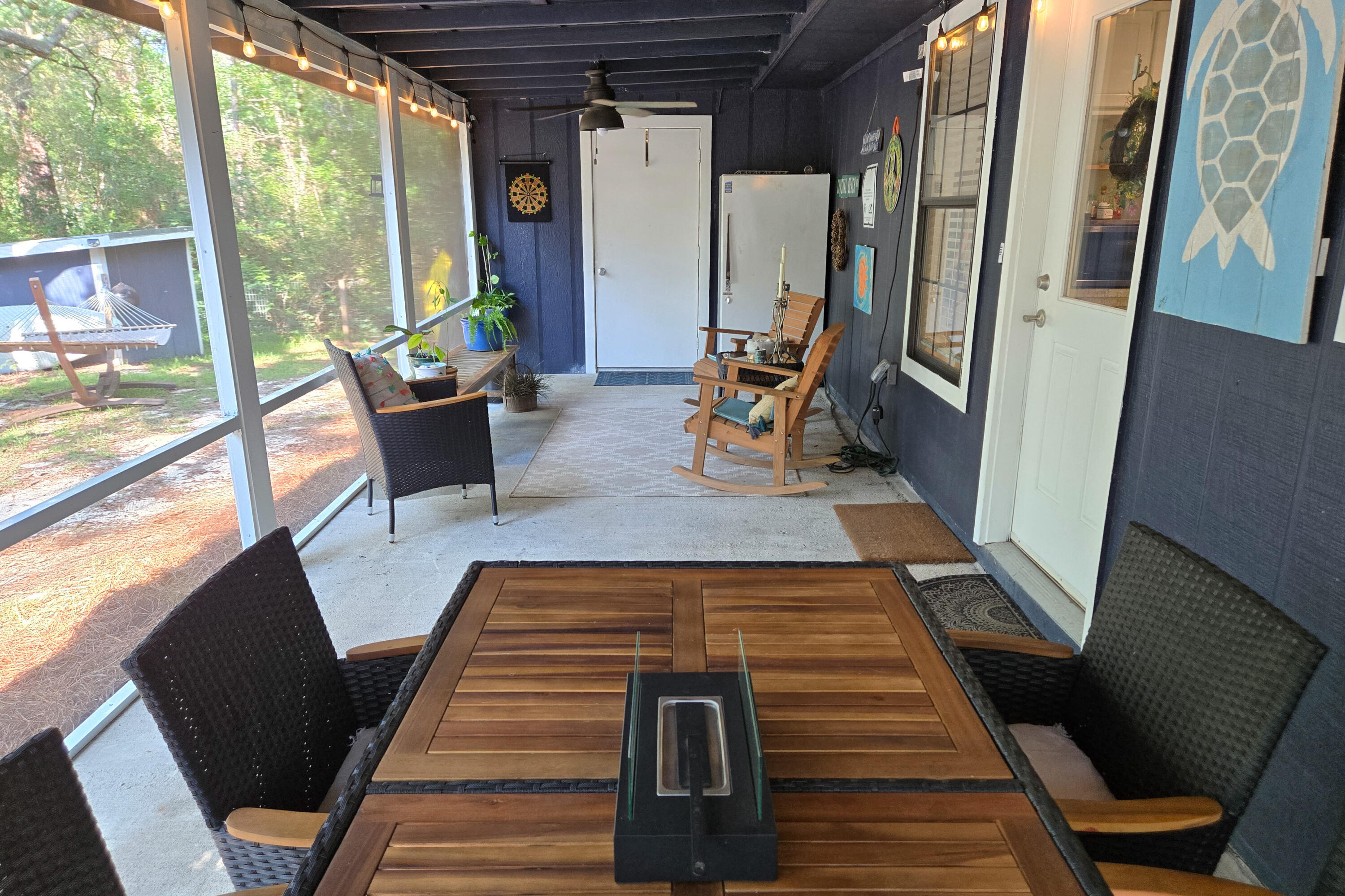 696 Phillips Drive Freeport, FL 32439 - Photo 28 of 49 a view of a living room with furniture and wooden floor