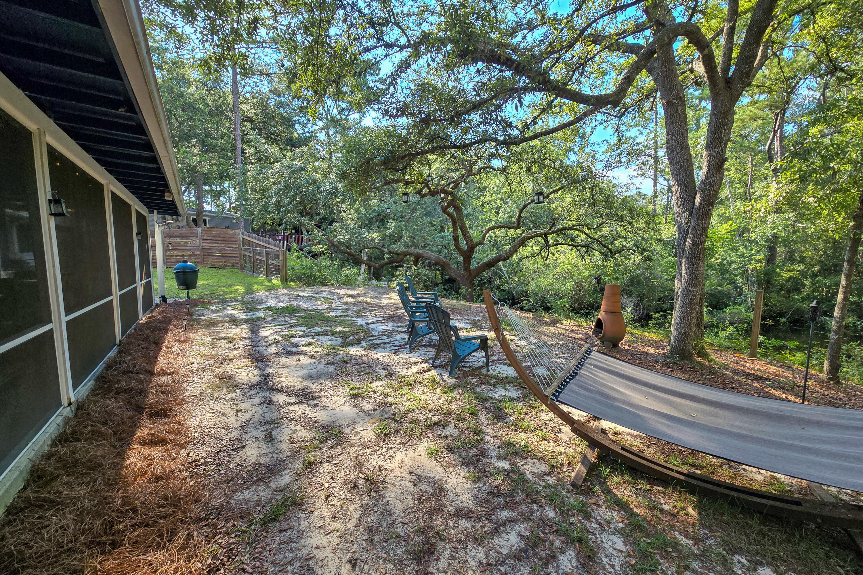 696 Phillips Drive Freeport, FL 32439 - Photo 31 of 49 a view of a backyard with sitting area