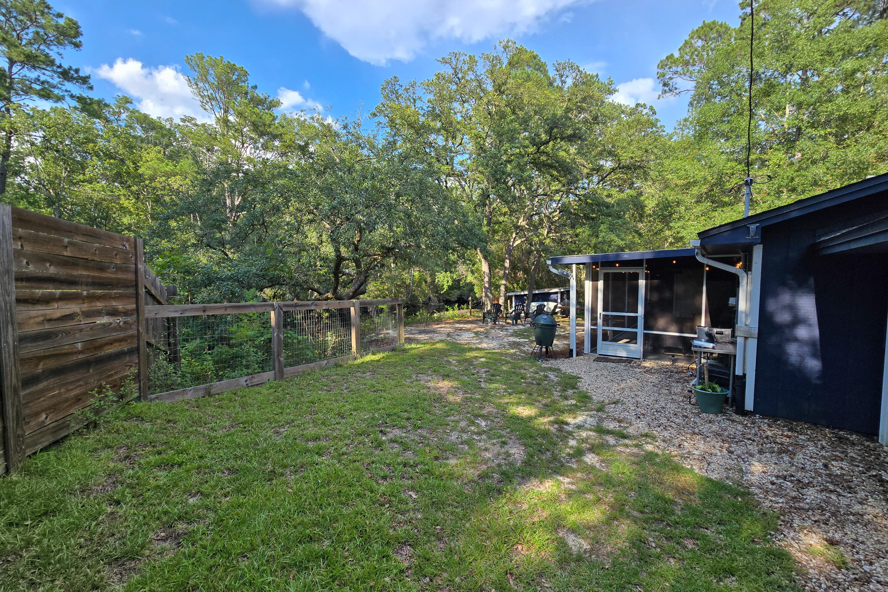 696 Phillips Drive Freeport, FL 32439 - Photo 34 of 49 a backyard of a house with seating space