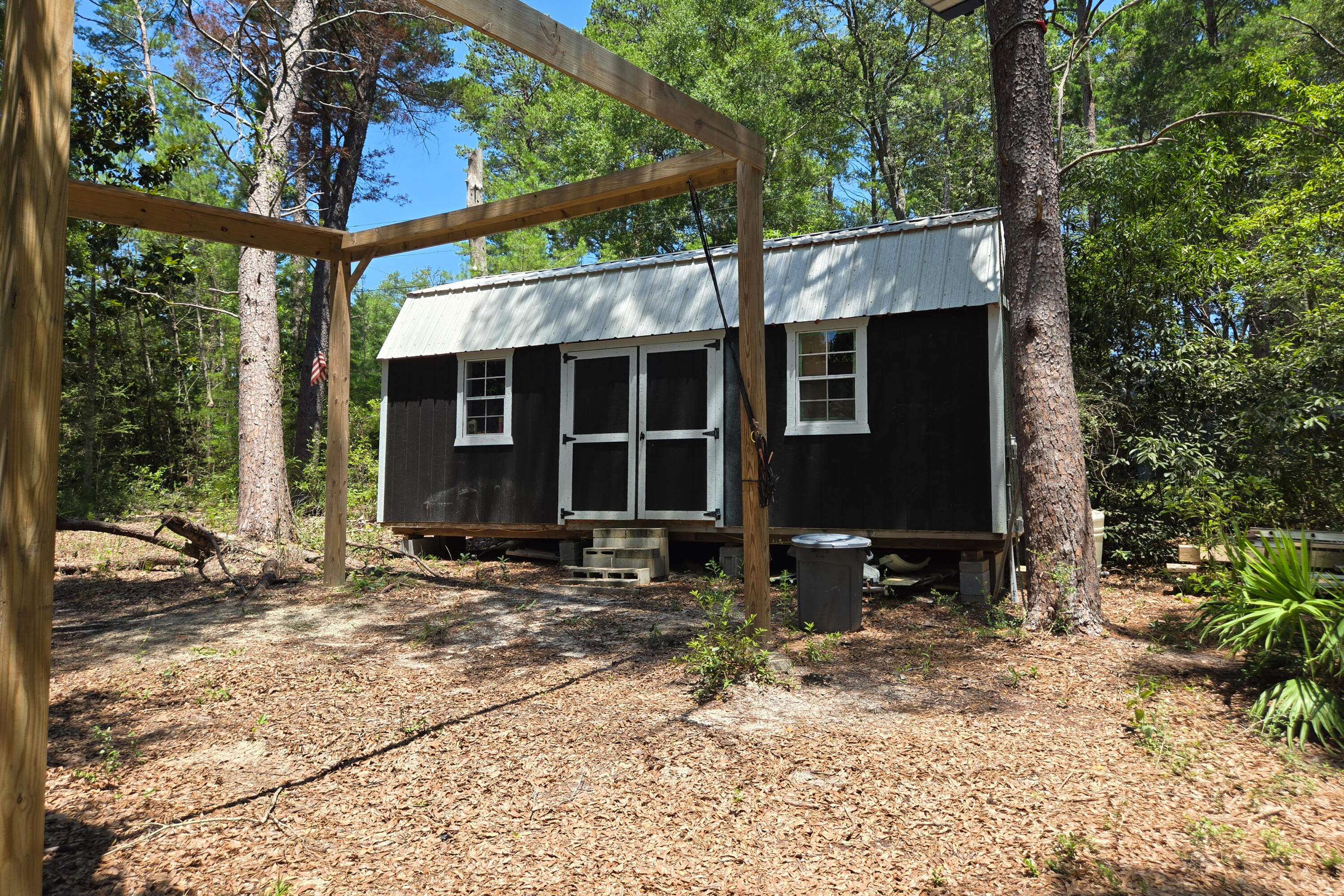696 Phillips Drive Freeport, FL 32439 - Photo 35 of 49 a view of a house with backyard and sitting area