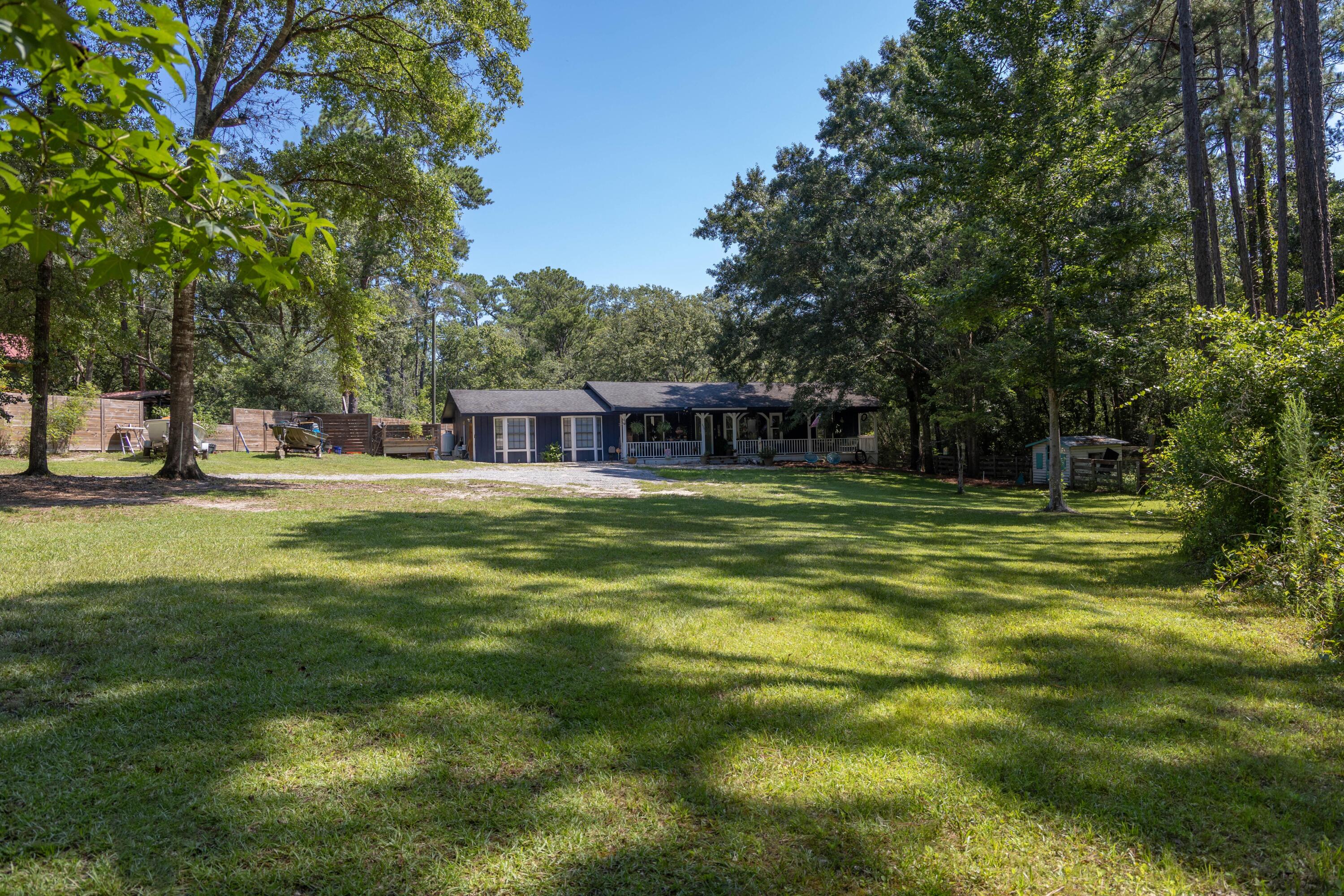 696 Phillips Drive Freeport, FL 32439 - Photo 37 of 49 a view of a house with a big yard