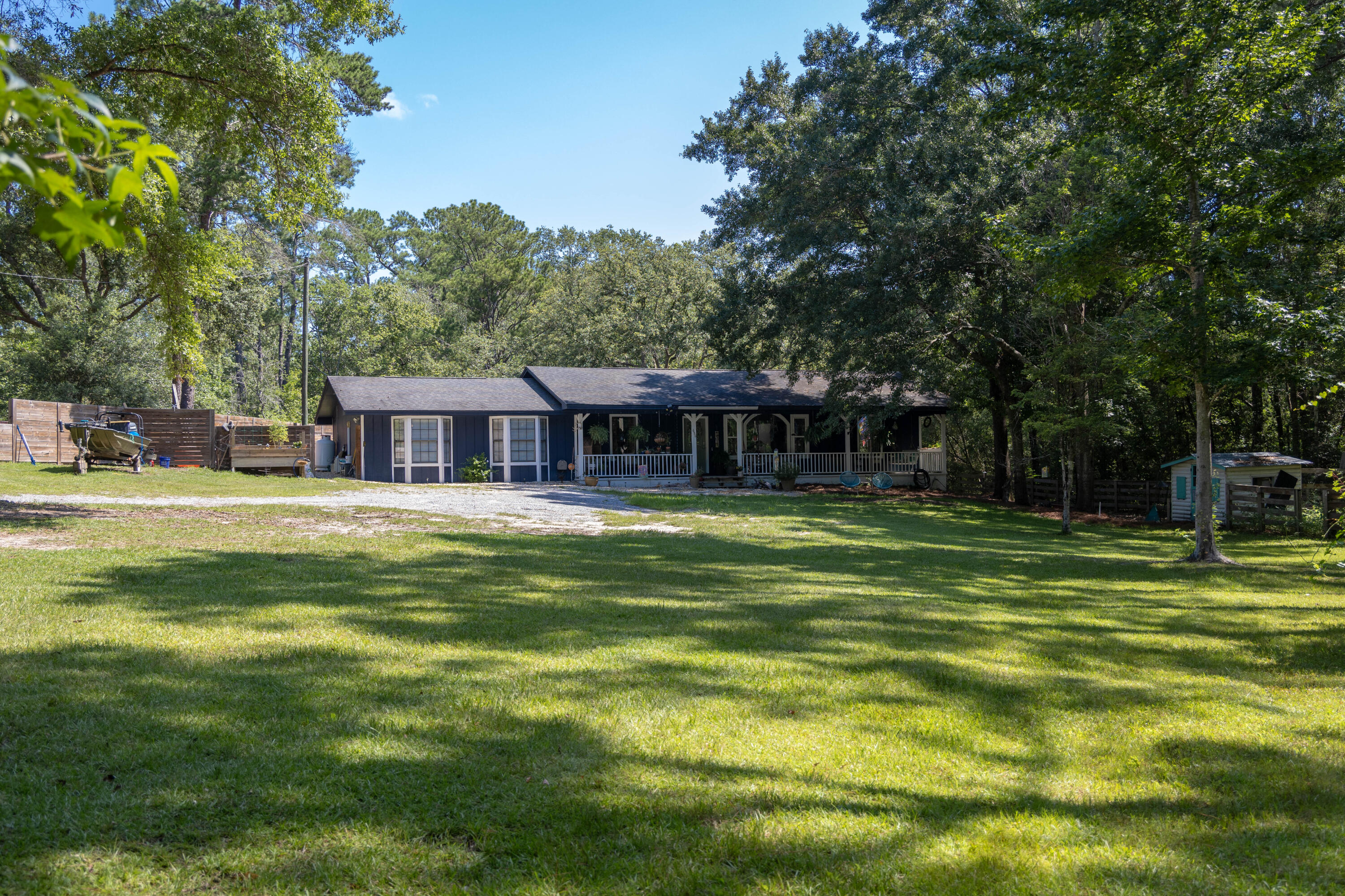696 Phillips Drive Freeport, FL 32439 - Photo 38 of 49 a front view of a house with a yard table and chairs