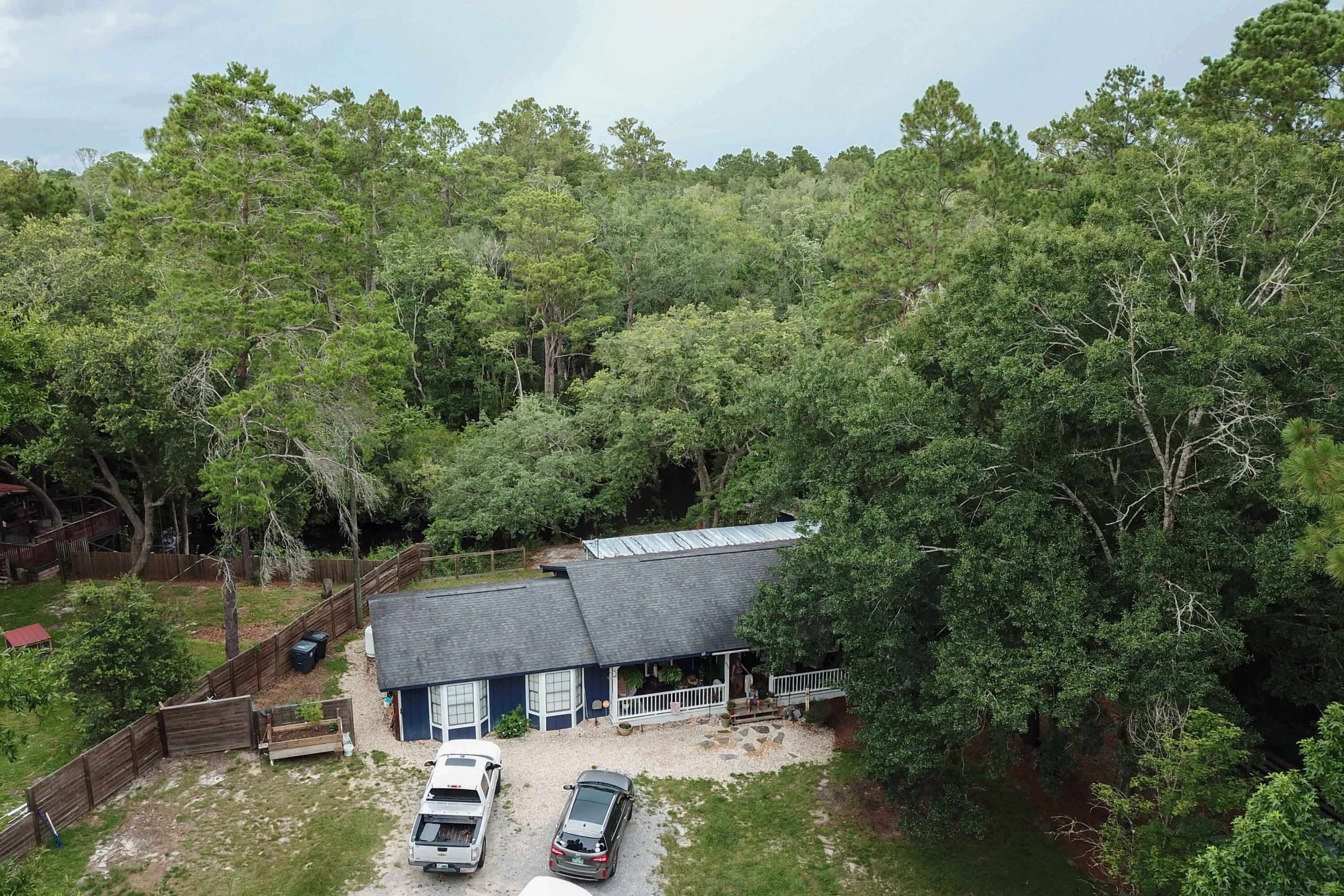 696 Phillips Drive Freeport, FL 32439 - Photo 39 of 49 an aerial view of a house with swimming pool and garden