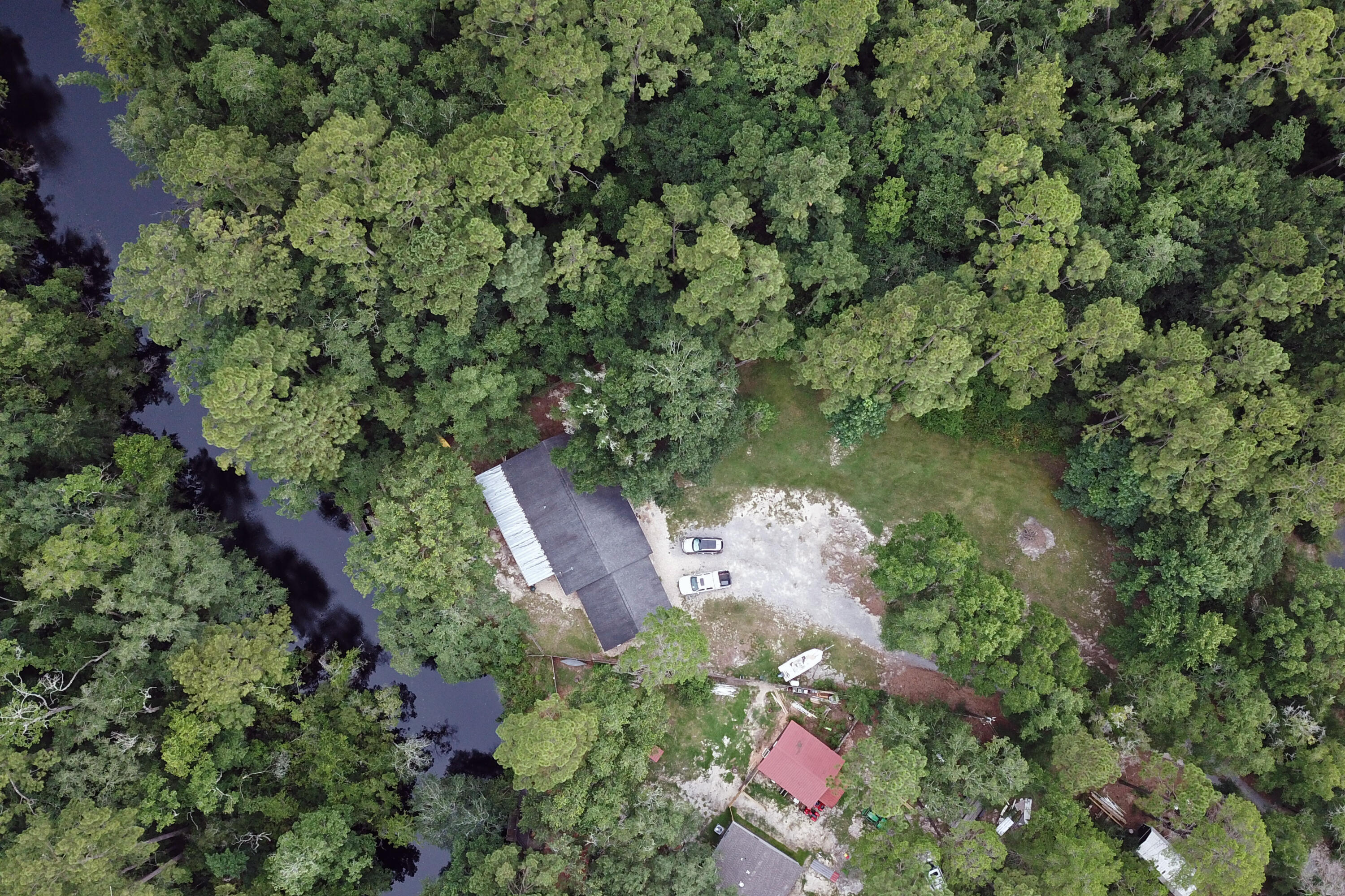 696 Phillips Drive Freeport, FL 32439 - Photo 44 of 49 an aerial view of residential house with outdoor space and trees all around