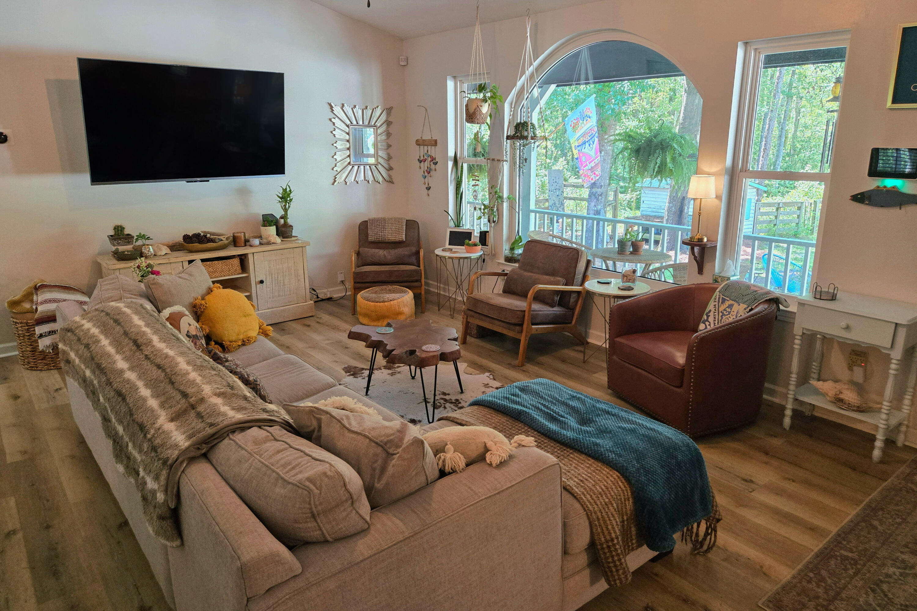 696 Phillips Drive Freeport, FL 32439 - Photo 7 of 49 a living room with furniture a flat screen tv and a large window