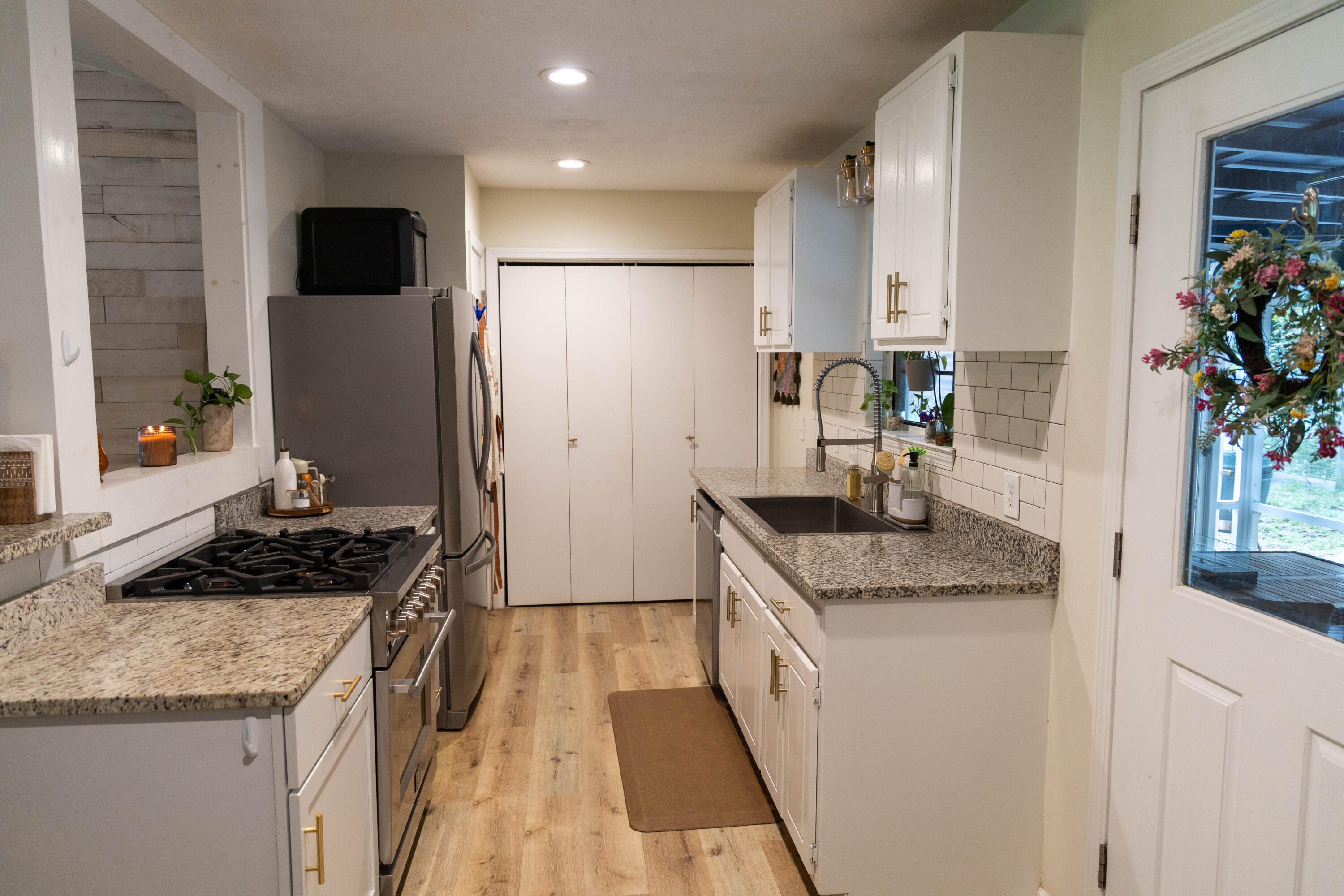 696 Phillips Drive Freeport, FL 32439 - Photo 9 of 49 a kitchen with stainless steel appliances granite countertop a sink stove and refrigerator