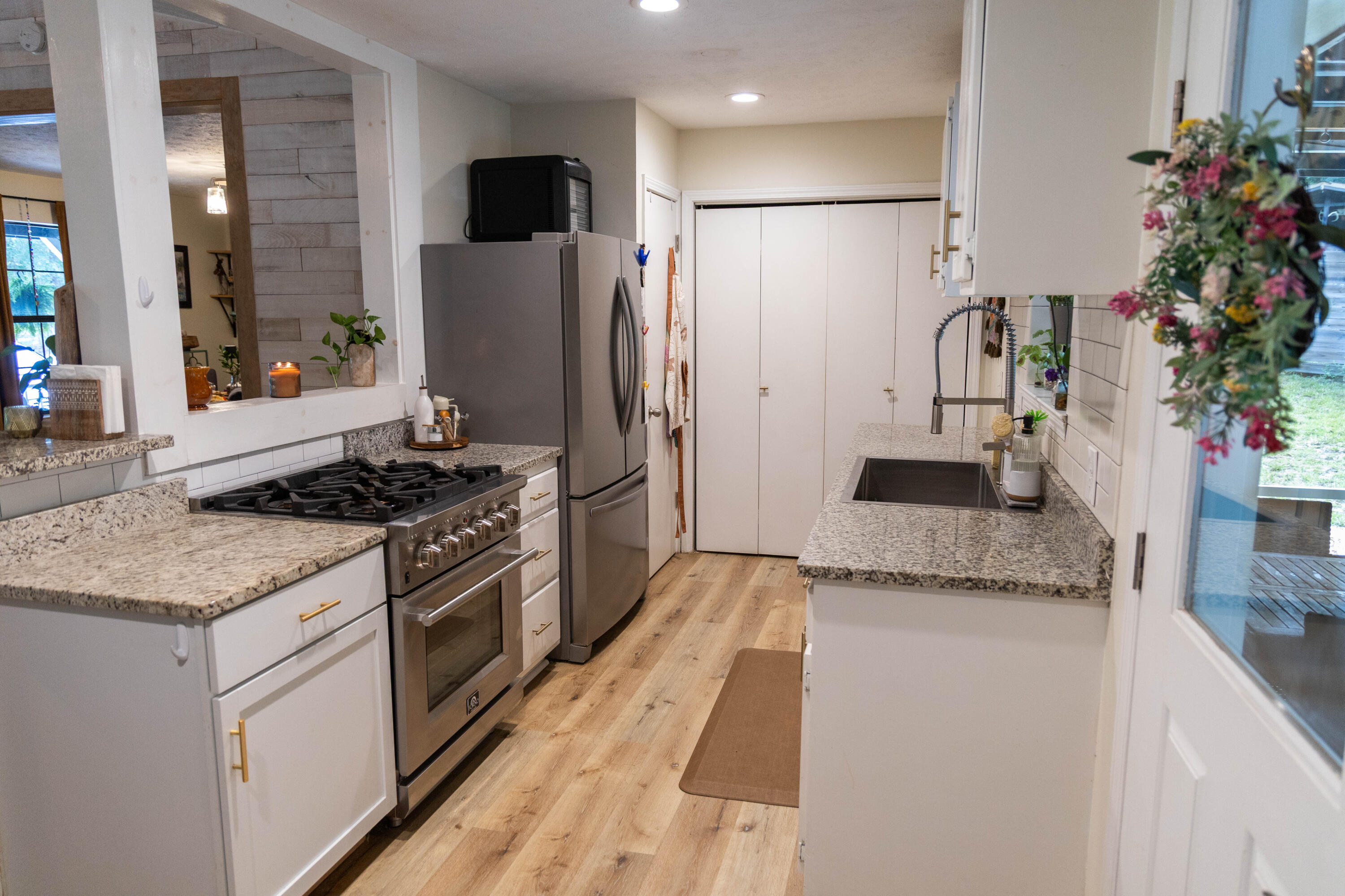 696 Phillips Drive Freeport, FL 32439 - Photo 10 of 49 a kitchen with granite countertop a refrigerator and a stove