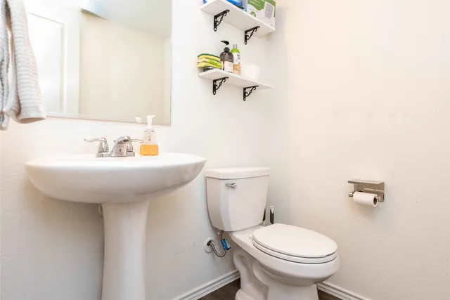 a kitchen with stainless steel appliances a stove a sink a microwave and cabinets