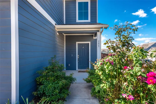 a view of entryway with flower pots