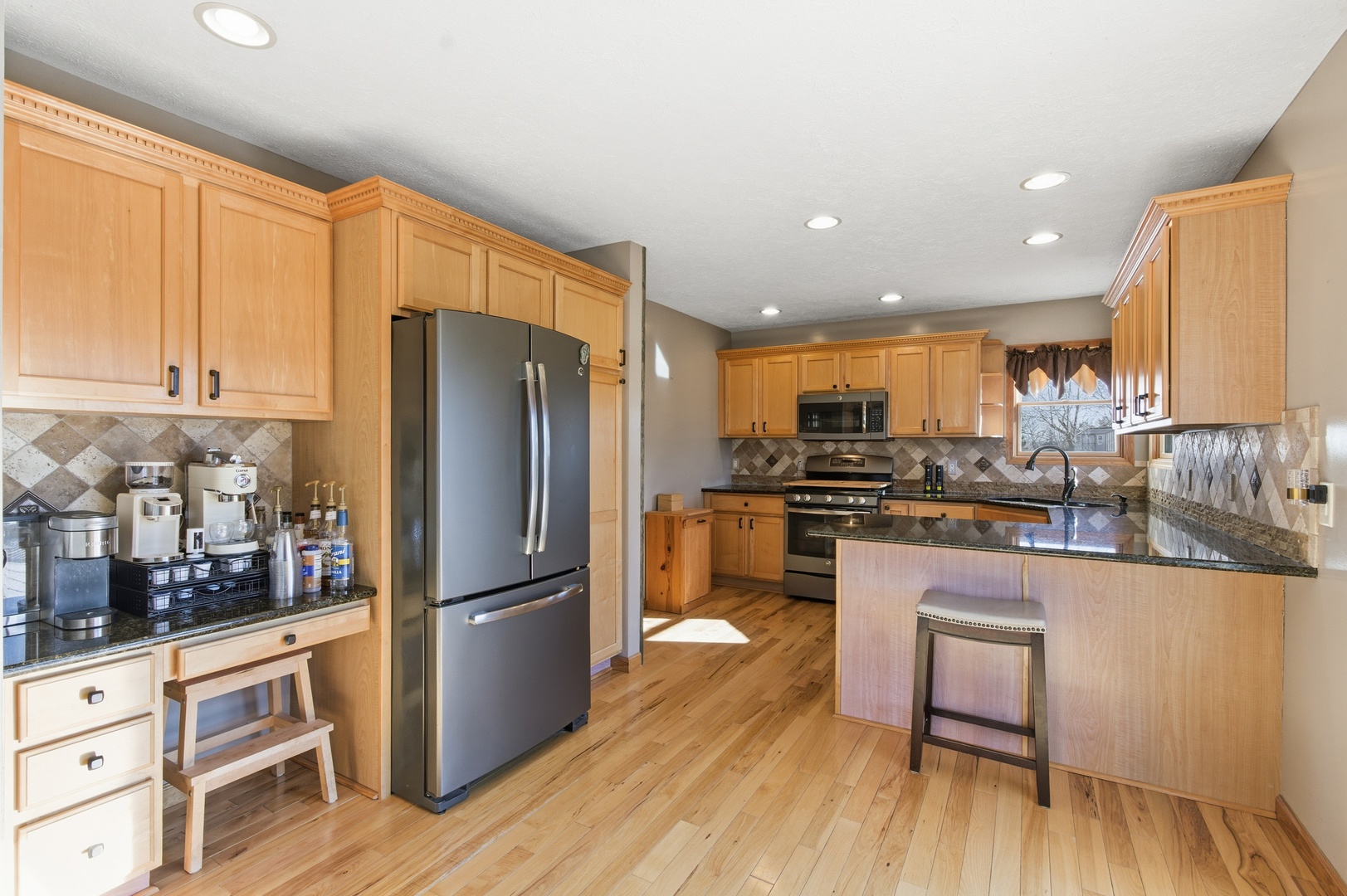 2216 North 2929th Road Marseilles, IL 61341 - Photo 13 of 49 a kitchen with stainless steel appliances granite countertop a refrigerator a stove and a wooden cabinets