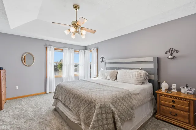 a spacious bathroom with a mirror sink and shower