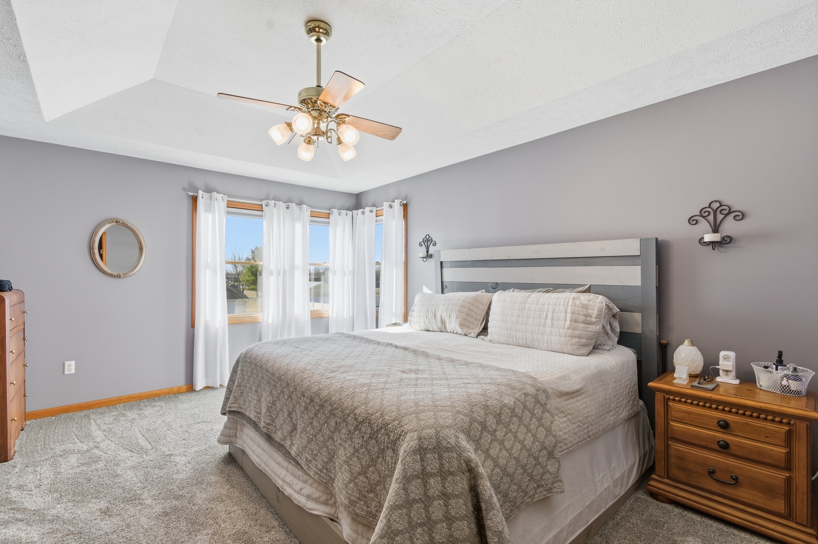 2216 North 2929th Road Marseilles, IL 61341 - Photo 18 of 49 a bedroom with a bed and a chandelier