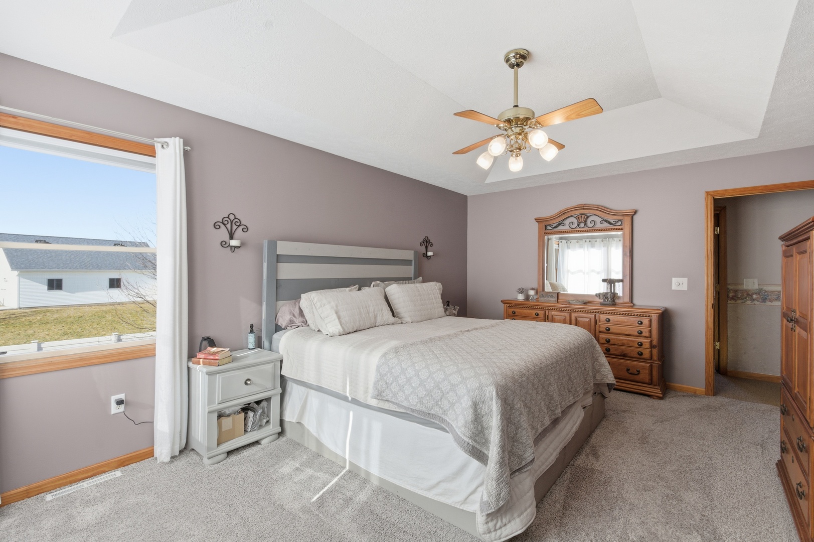 2216 North 2929th Road Marseilles, IL 61341 - Photo 19 of 49 a bedroom with a bed and a chandelier