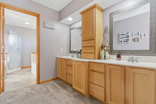 a bedroom with furniture and a chandelier