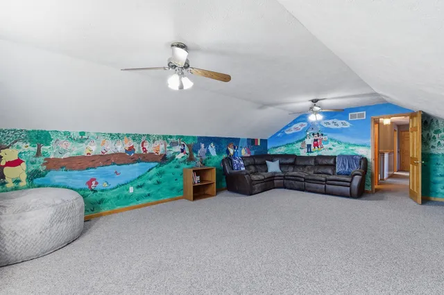 a view of a chairs and table in a room