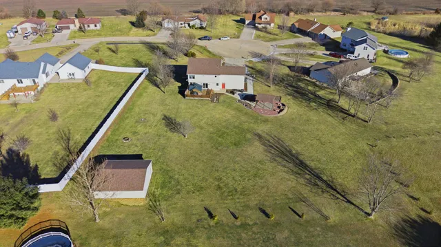 a front view of house with yard and trees