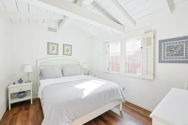 a bedroom with a bed and hallway