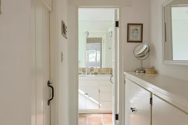 a bathroom with a sink toilet vanity and shower