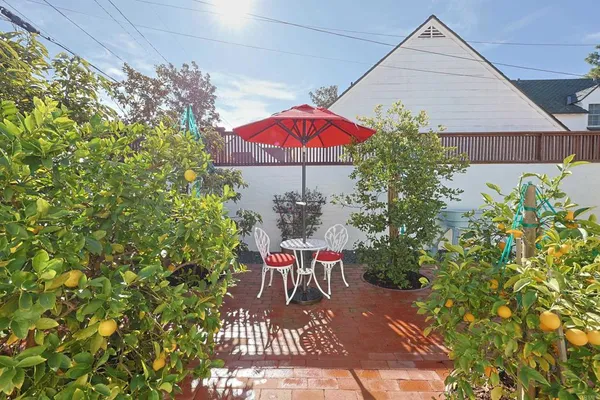 an outdoor space with furniture and umbrella