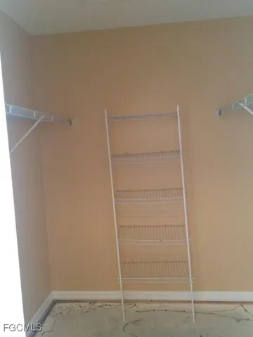 a view of an empty walk in closet