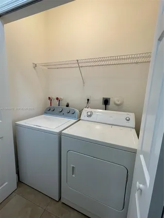 a utility room with dryer and washer