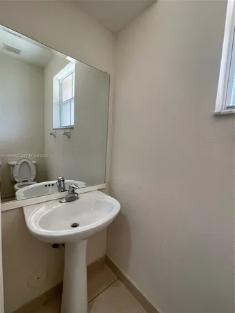 a bathroom with a sink and a toilet
