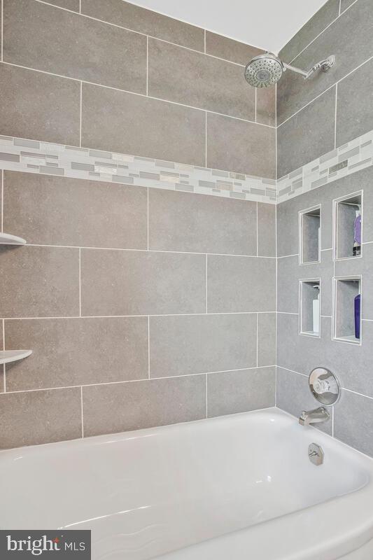 7215 Conley Street Baltimore, MD 21224 - Photo 22 of 38 a bathroom with bathtub and shower