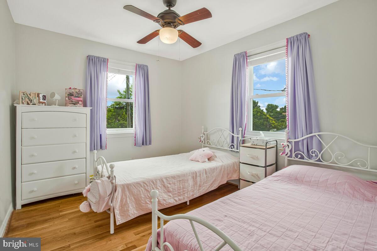 7215 Conley Street Baltimore, MD 21224 - Photo 23 of 38 a bedroom with two beds and a window