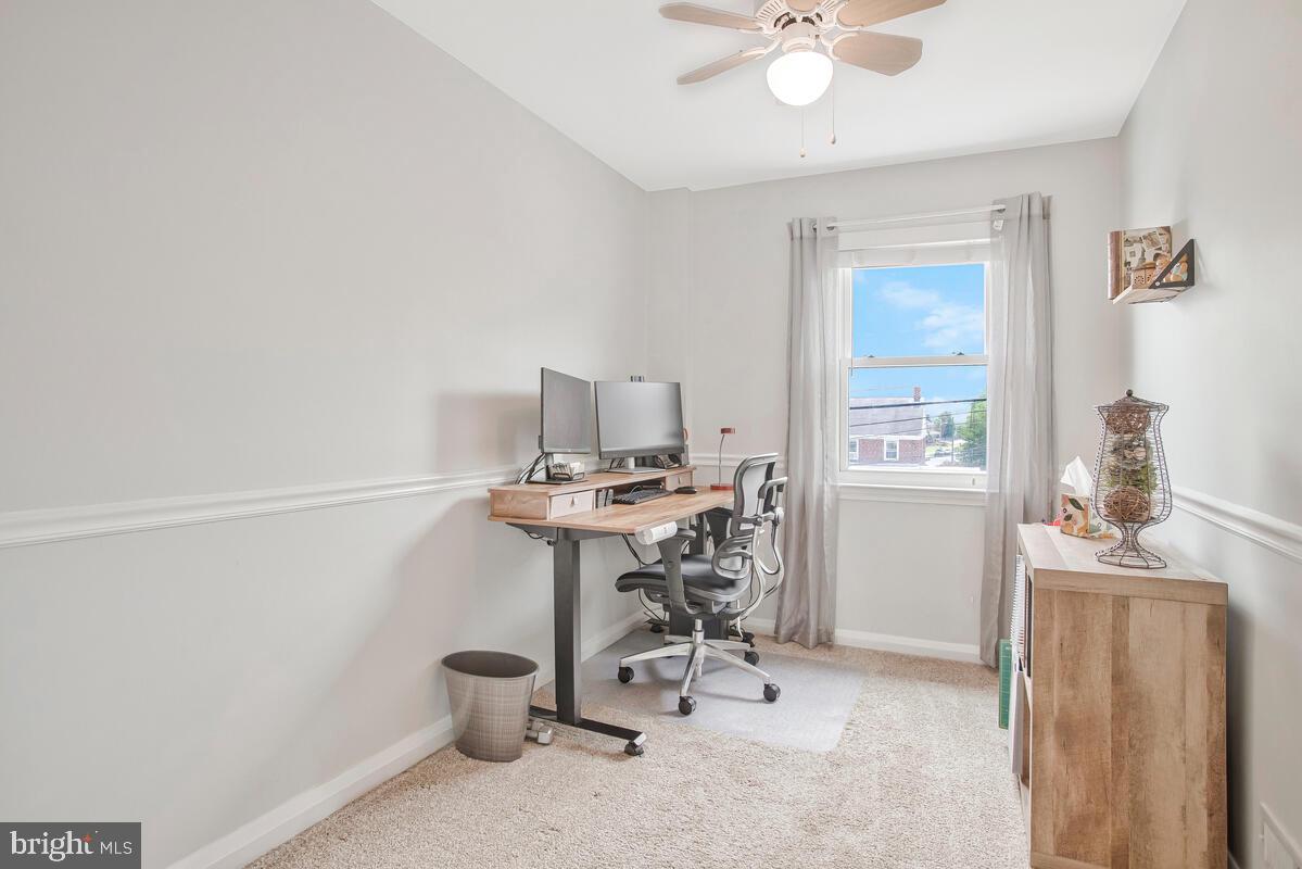 7215 Conley Street Baltimore, MD 21224 - Photo 25 of 38 a view of a workspace with furniture and a window