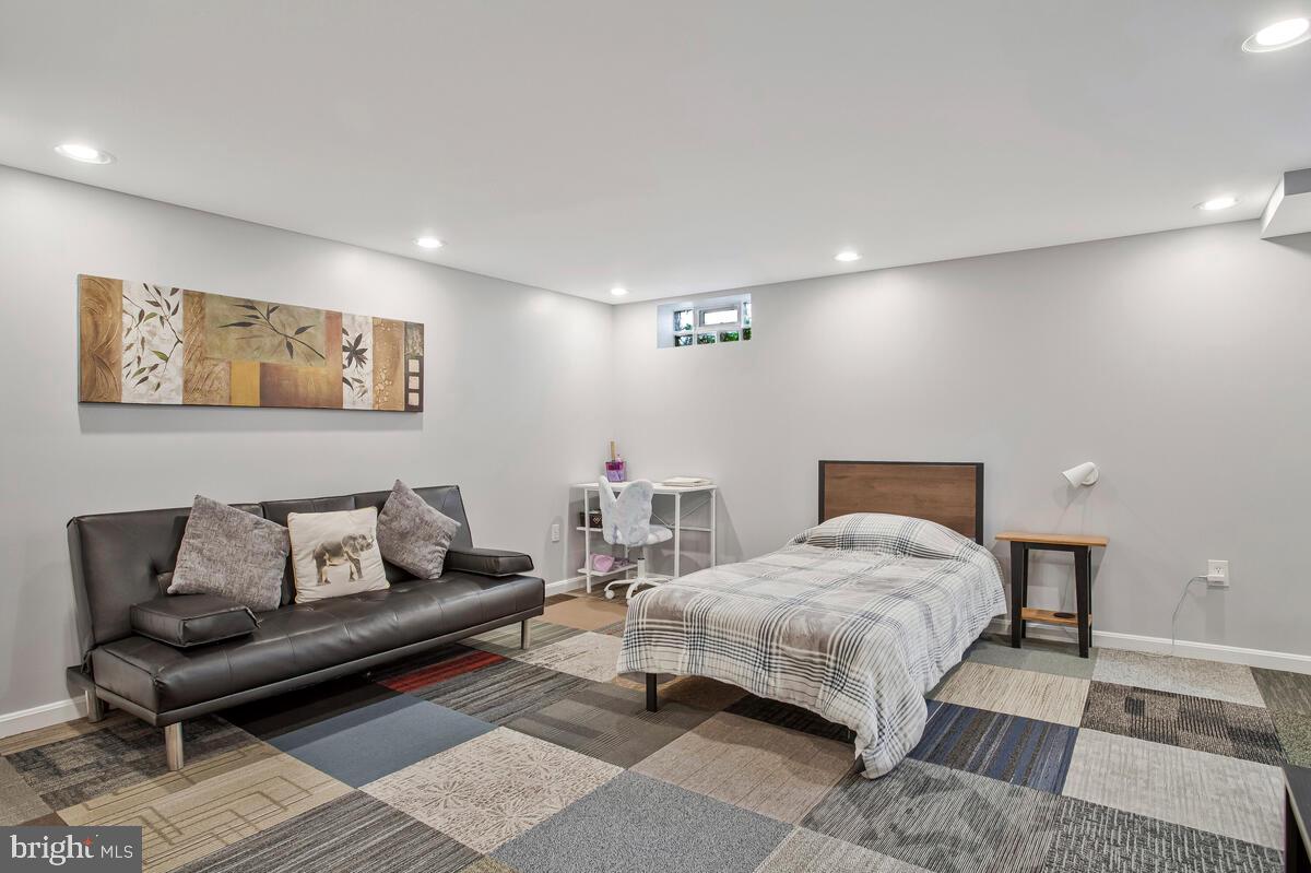 7215 Conley Street Baltimore, MD 21224 - Photo 27 of 38 a bedroom with a bed and a couch