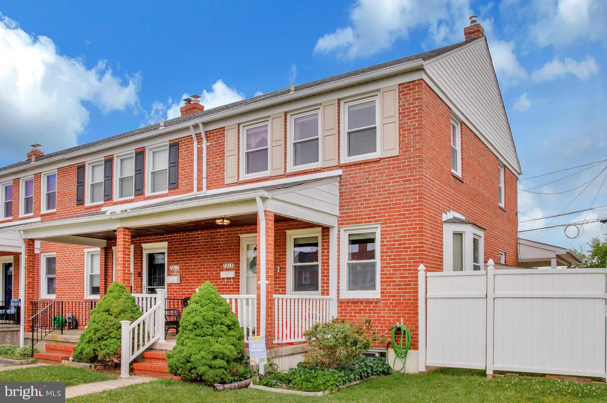 7215 Conley Street Baltimore, MD 21224 - Photo 3 of 38 a front view of a house with garden