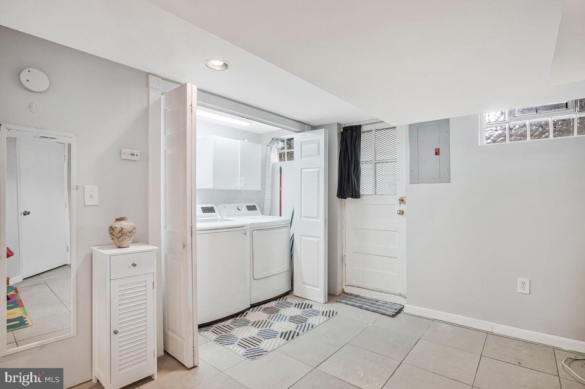 7215 Conley Street Baltimore, MD 21224 - Photo 31 of 38 a bathroom with a sink a toilet and shower