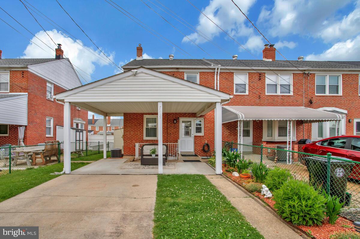 7215 Conley Street Baltimore, MD 21224 - Photo 34 of 38 a front view of a house with garden and porch