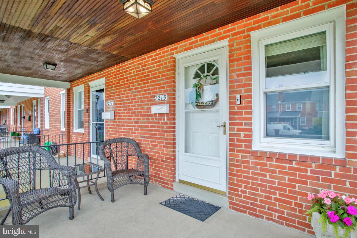 7215 Conley Street Baltimore, MD 21224 - Photo 4 of 38 a front view of a house with outdoor seating