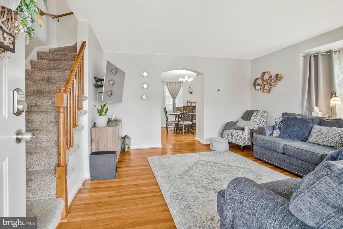 7215 Conley Street Baltimore, MD 21224 - Photo 6 of 38 a living room with furniture and a rug