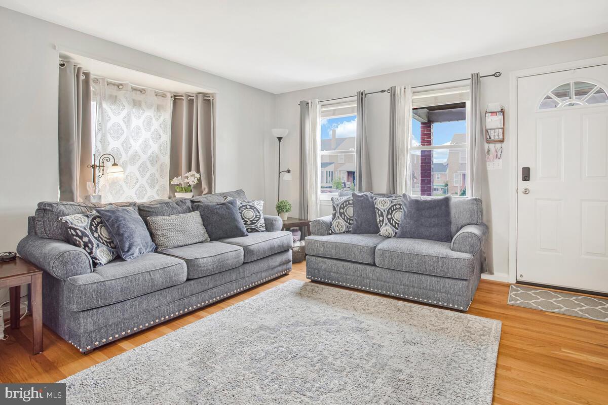 7215 Conley Street Baltimore, MD 21224 - Photo 8 of 38 a living room with furniture and a large window