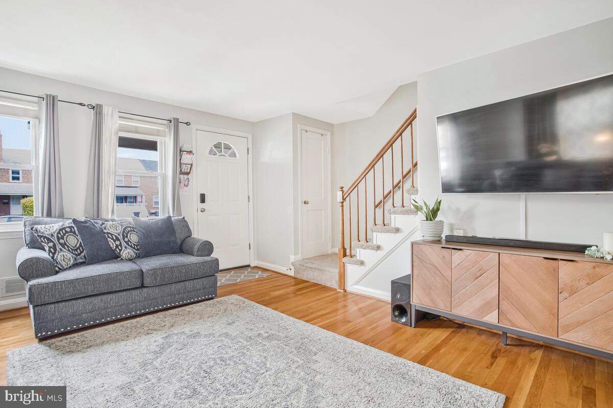 7215 Conley Street Baltimore, MD 21224 - Photo 9 of 38 a living room with furniture and a flat screen tv