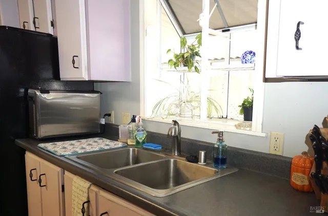 a kitchen with a stove and a refrigerator