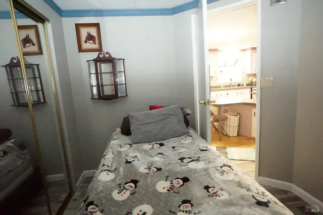 a bathroom with a toilet a sink and a mirror