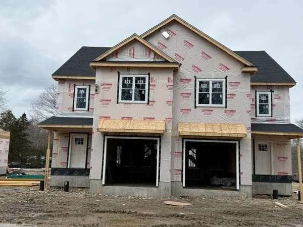 a front view of a house with a yard