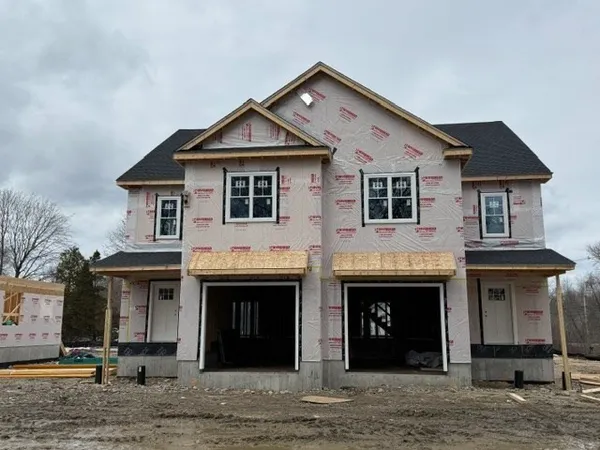 a front view of a house with yard