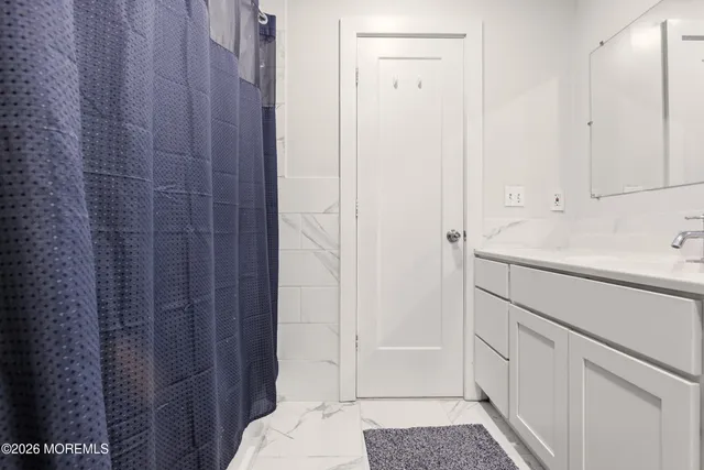 a bathroom with a sink and vanity