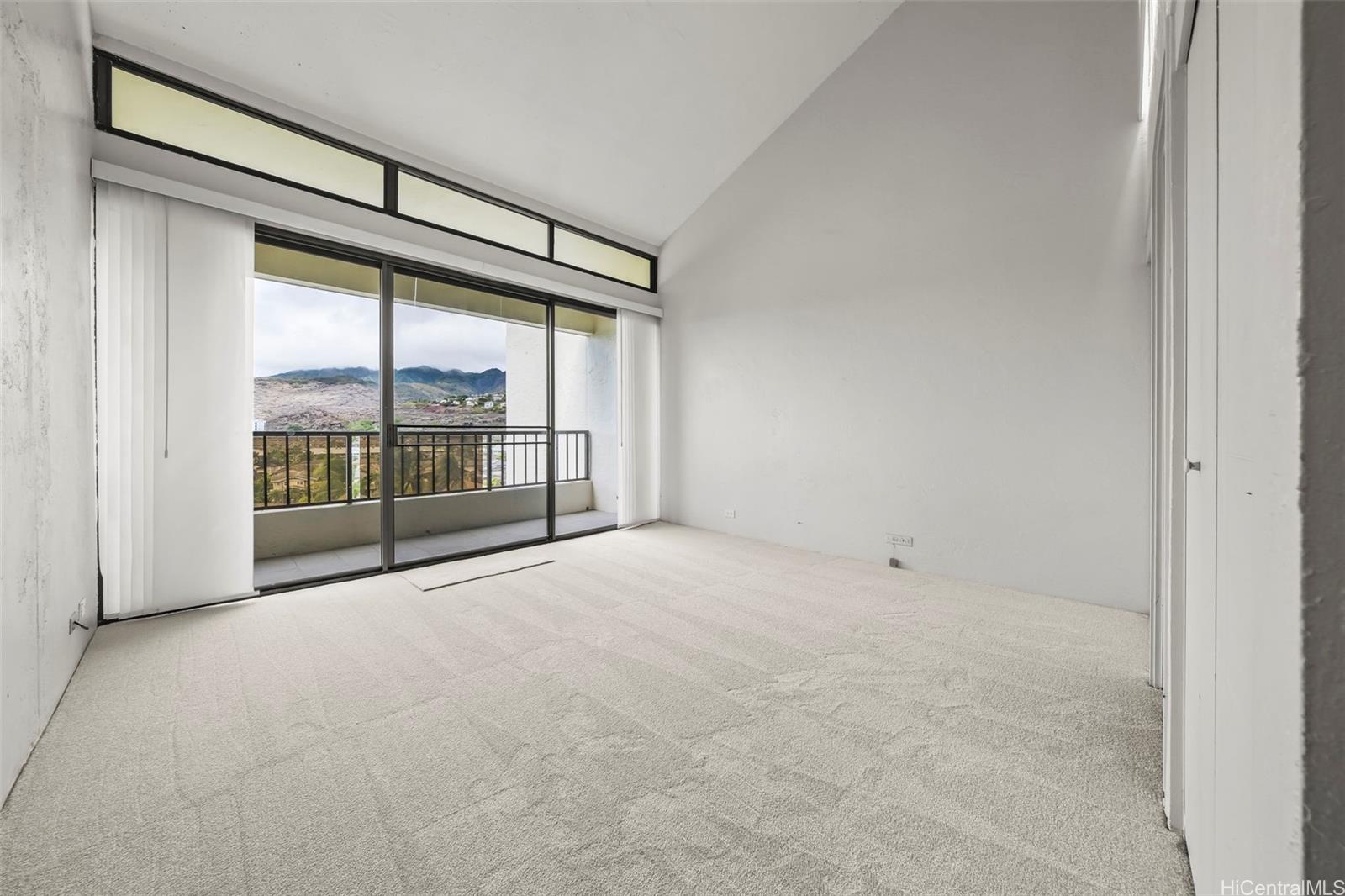 500 Lunalilo Home Road, Unit 17A Honolulu, HI 96825 - Photo 14 of 25 a view of an empty room with glass door