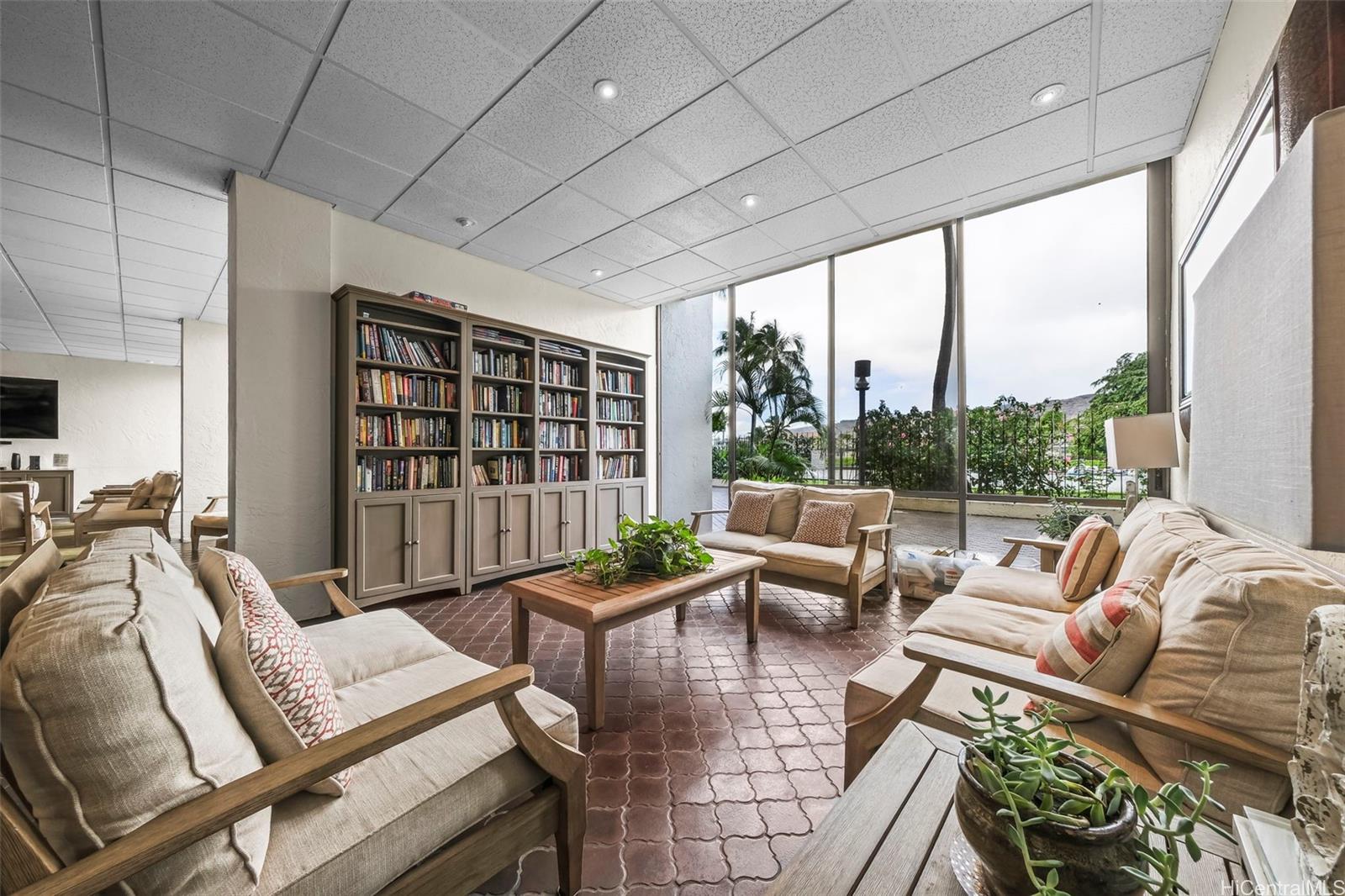 500 Lunalilo Home Road, Unit 17A Honolulu, HI 96825 - Photo 25 of 25 a living room with furniture floor to ceiling window and floor to ceiling window